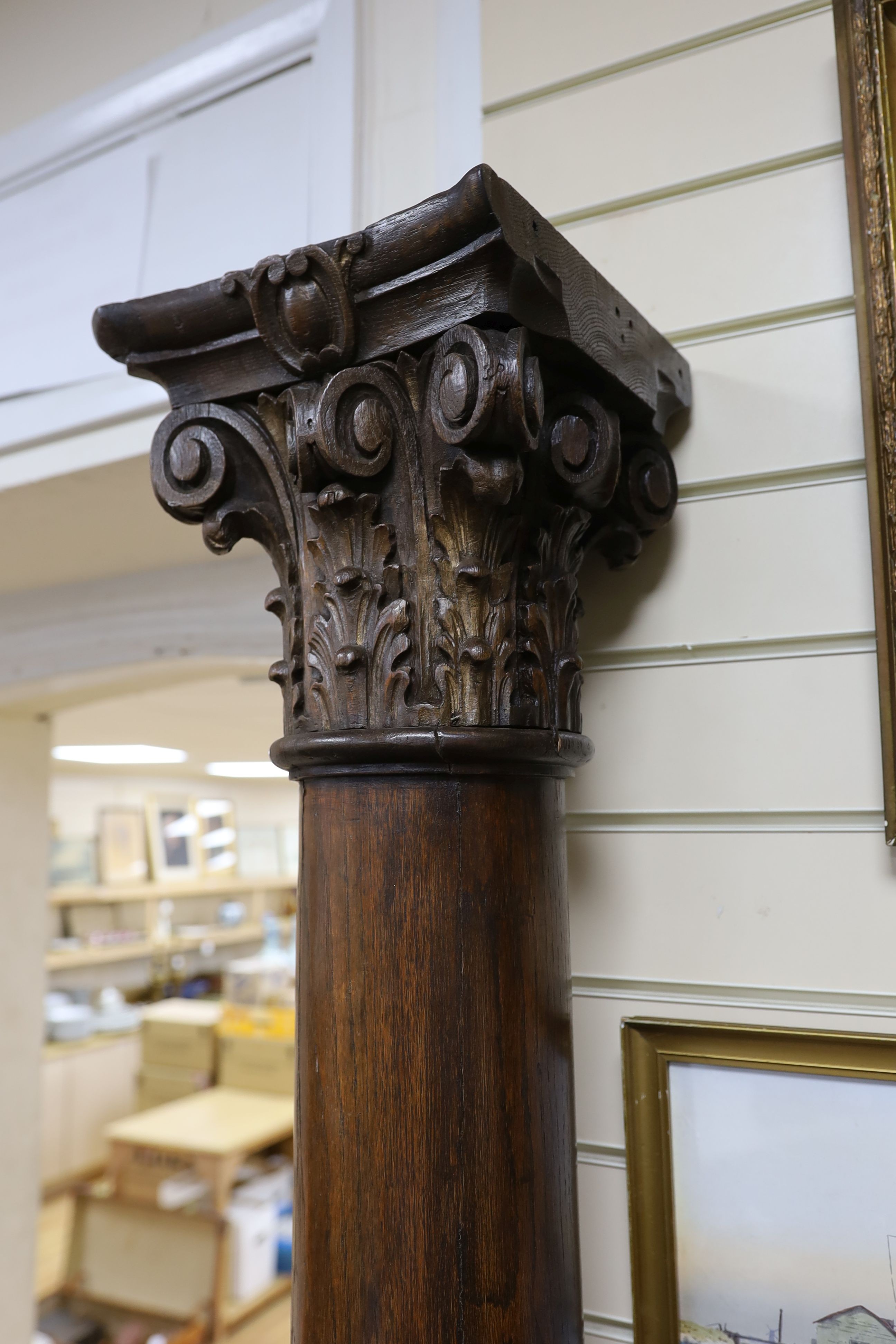 A pair of carved oak Corinthian columns, height 200cm